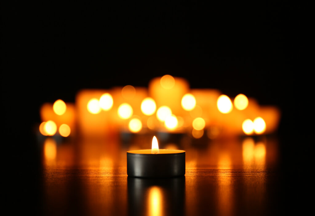  for memorial Burning candles on dark background