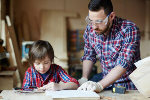 Family of father and son drawing sketch of starling-house